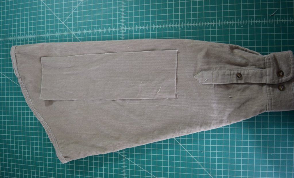 use one rectangle as a guide to cut the other sleeve