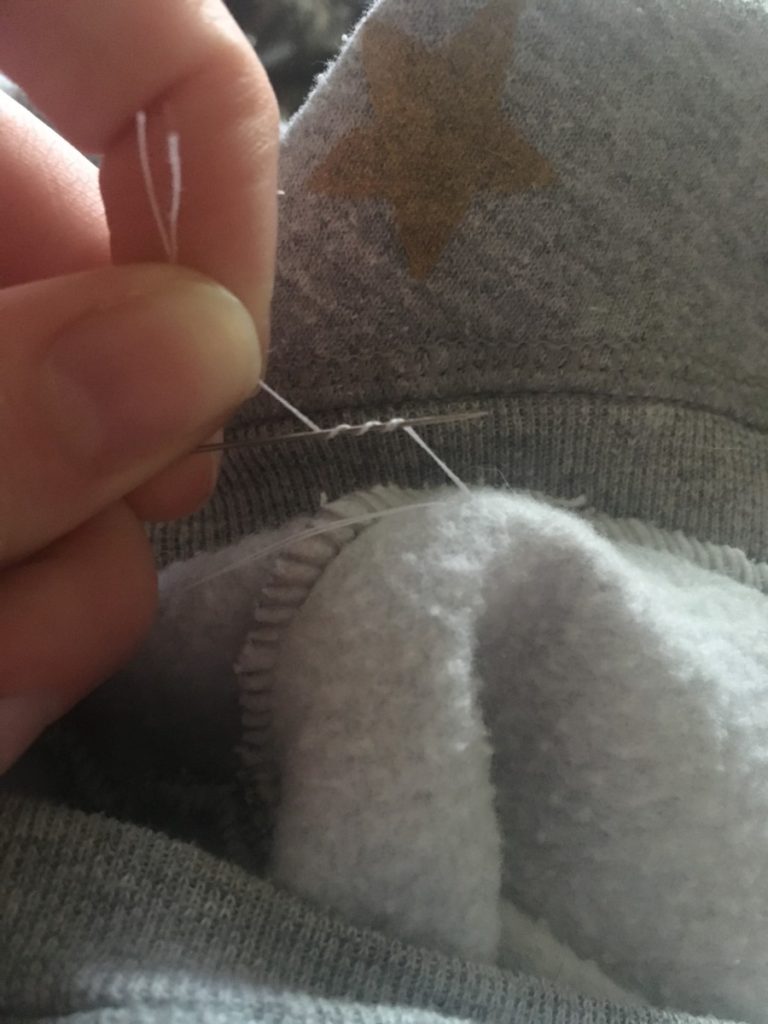 wrap the tail end around the needle from other direction