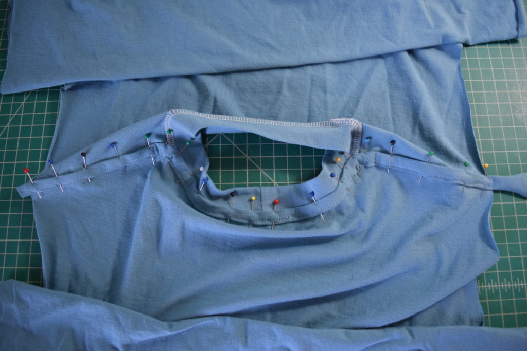pin the folded stabilizer in place, encasing the serging