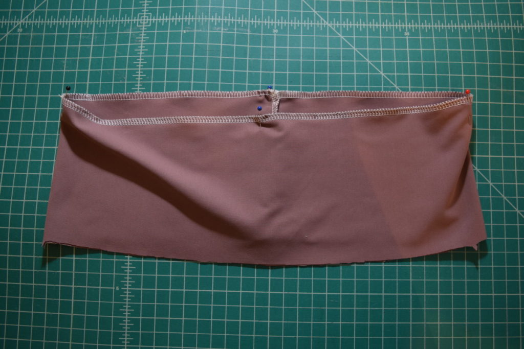 four equally spaced pins in waistband top edge