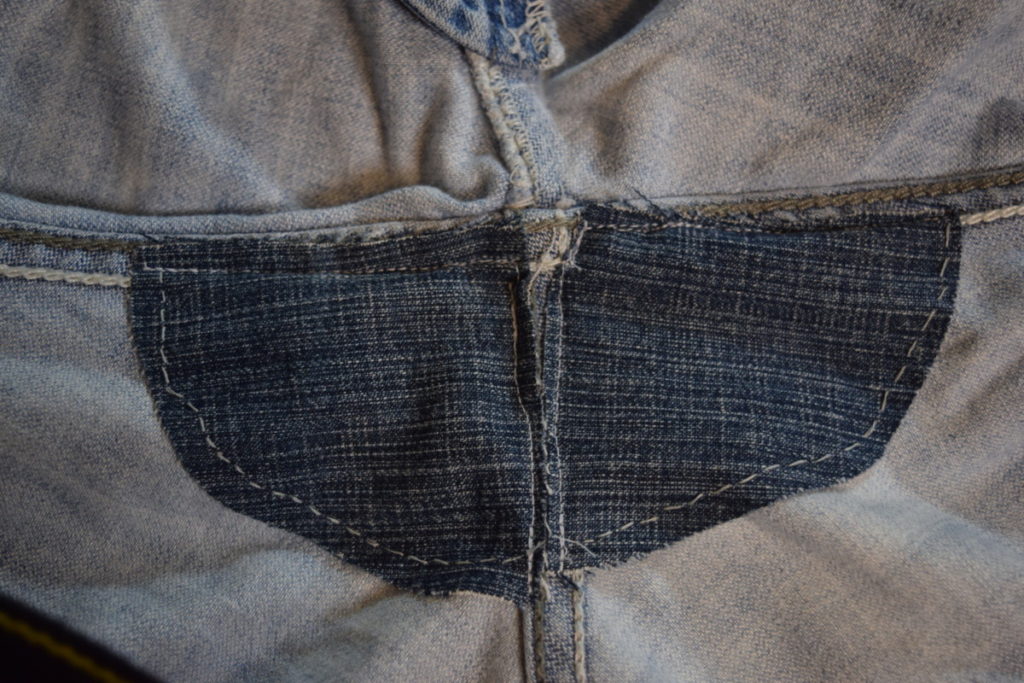 two triangular patches sewn into jean crotch to reinforce it