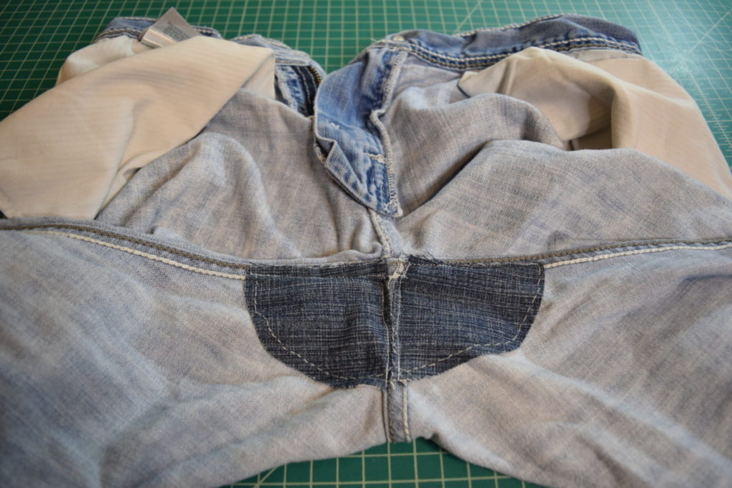 the crotch of the jeans is reinforced with two triangular denim patches