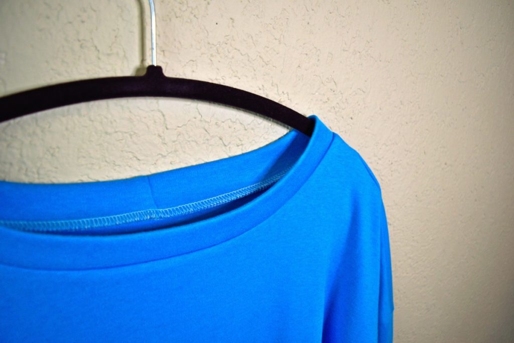 beautiful neckband sewn on a blue knit top