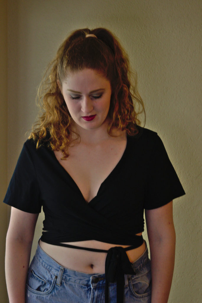 black wrap style crop top front view up close