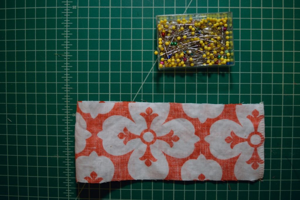 orange and white linen rectangle sewn together on the short ends