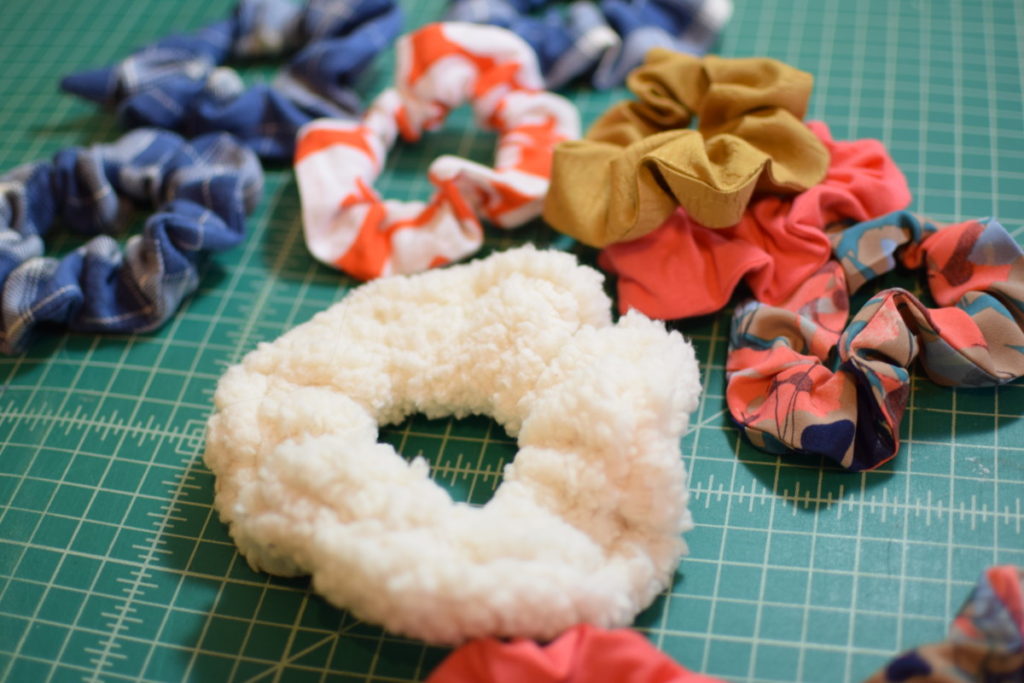 a pile of 10 scrunchies on a green cutting mat