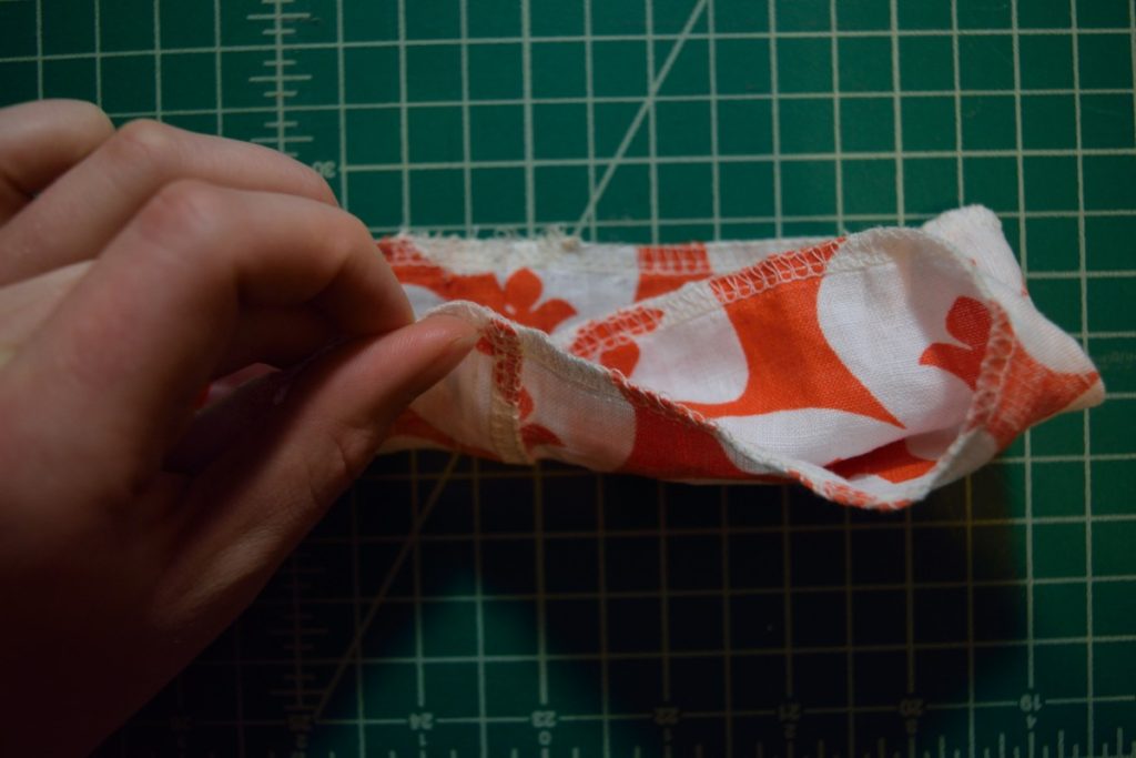 folding the outside layer around the top layer of the scrunchie