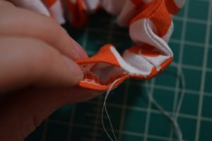 hand sewing a scrunchie closed step 2