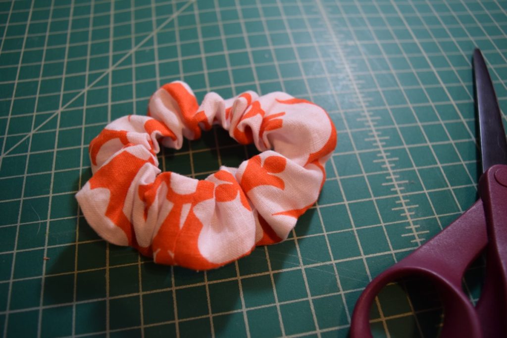 a finished orange and white scrunchie