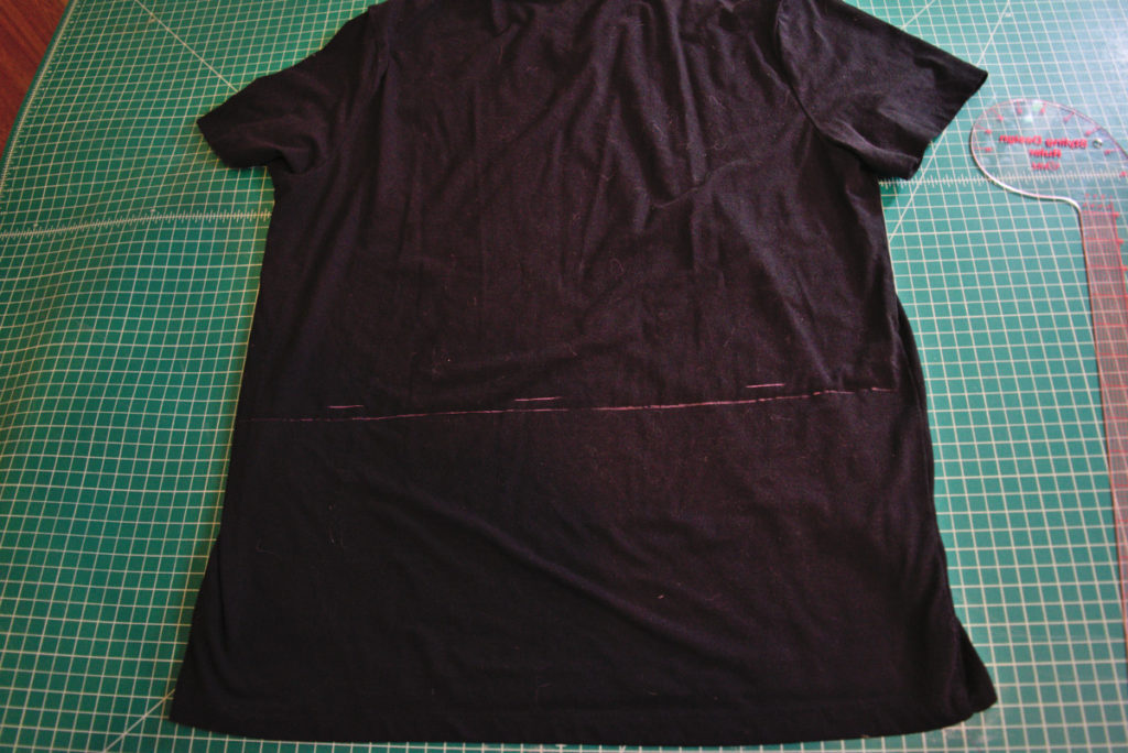 a chalk line drawn across the back of a t shirt