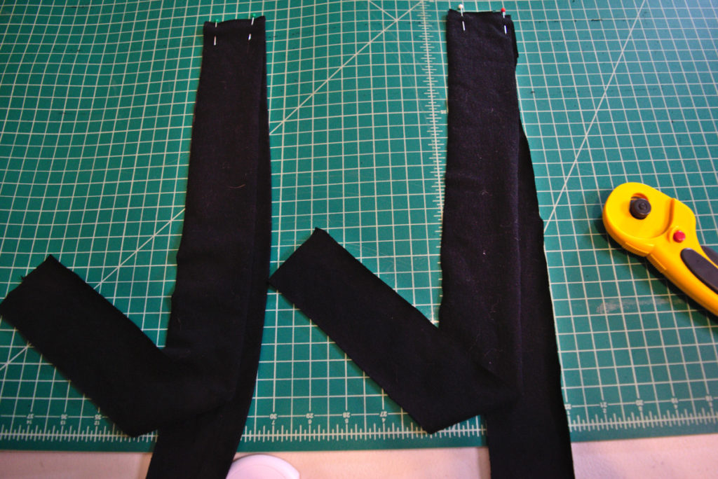 two pairs of ties are pinned together at one of the short ends