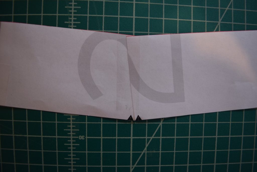 overlapped edges along top edge of curved waistband patter