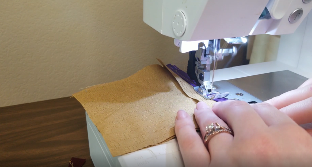 sewing the bias tape to the seam allowance in a bias bound seam