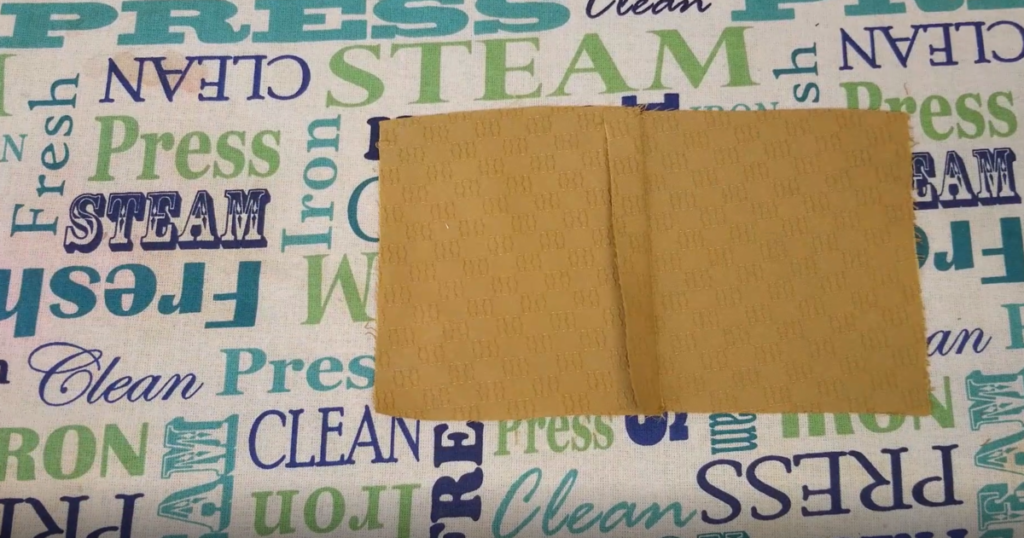 seam allowances pressed to one side on a mustard fabric