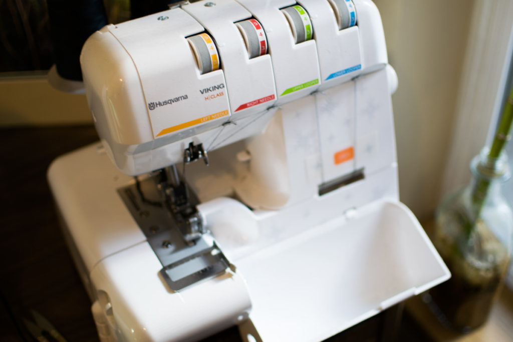 a husqvarna viking serger photographed at an angle from above