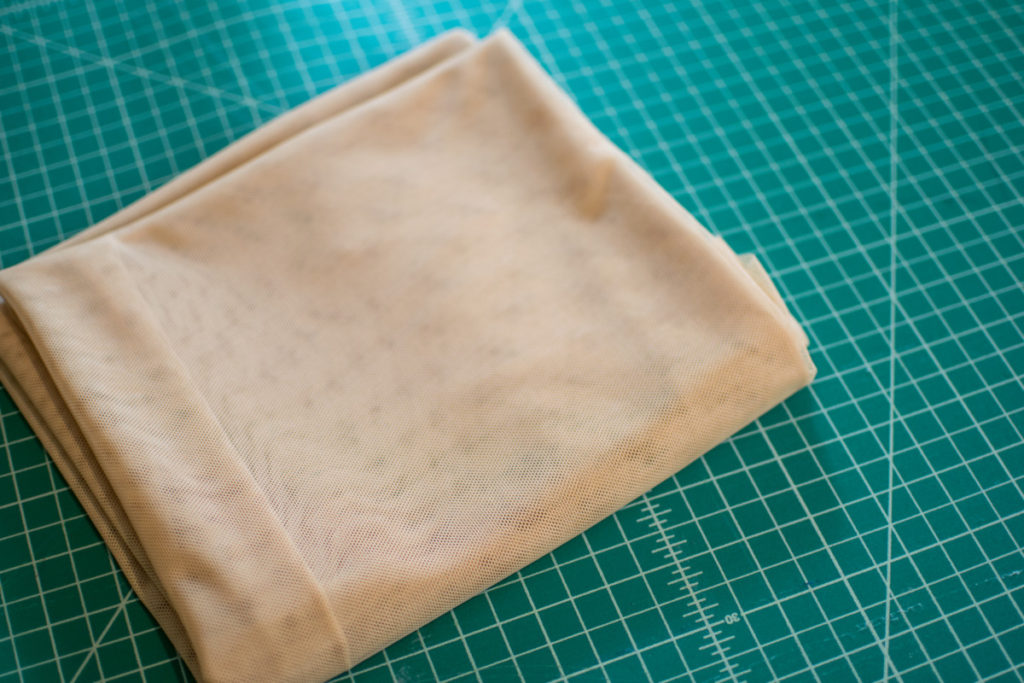 power mesh fabric folded on a cutting mat