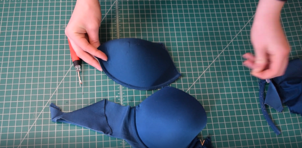 turquoise foam bra cup removed from a bra