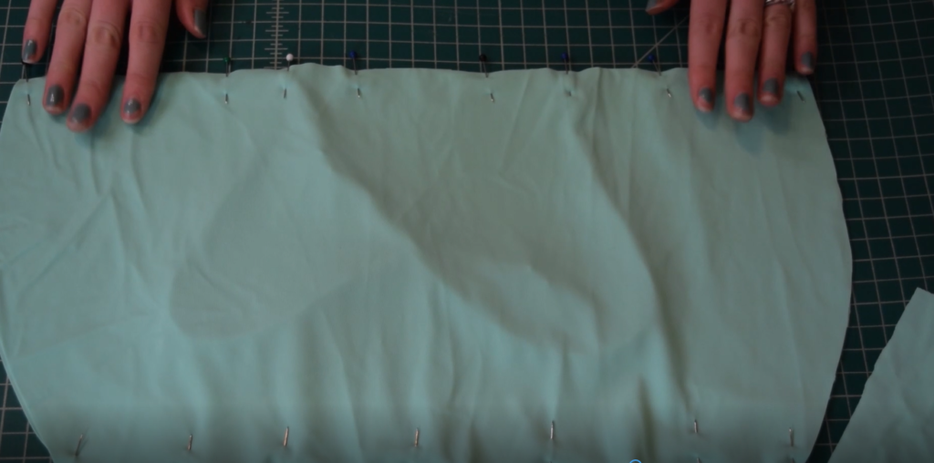 front pieces of mint green bandeau pinned at top and bottom edges