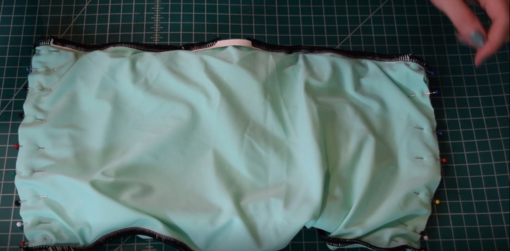 side seams of mint green bandeau are pinned